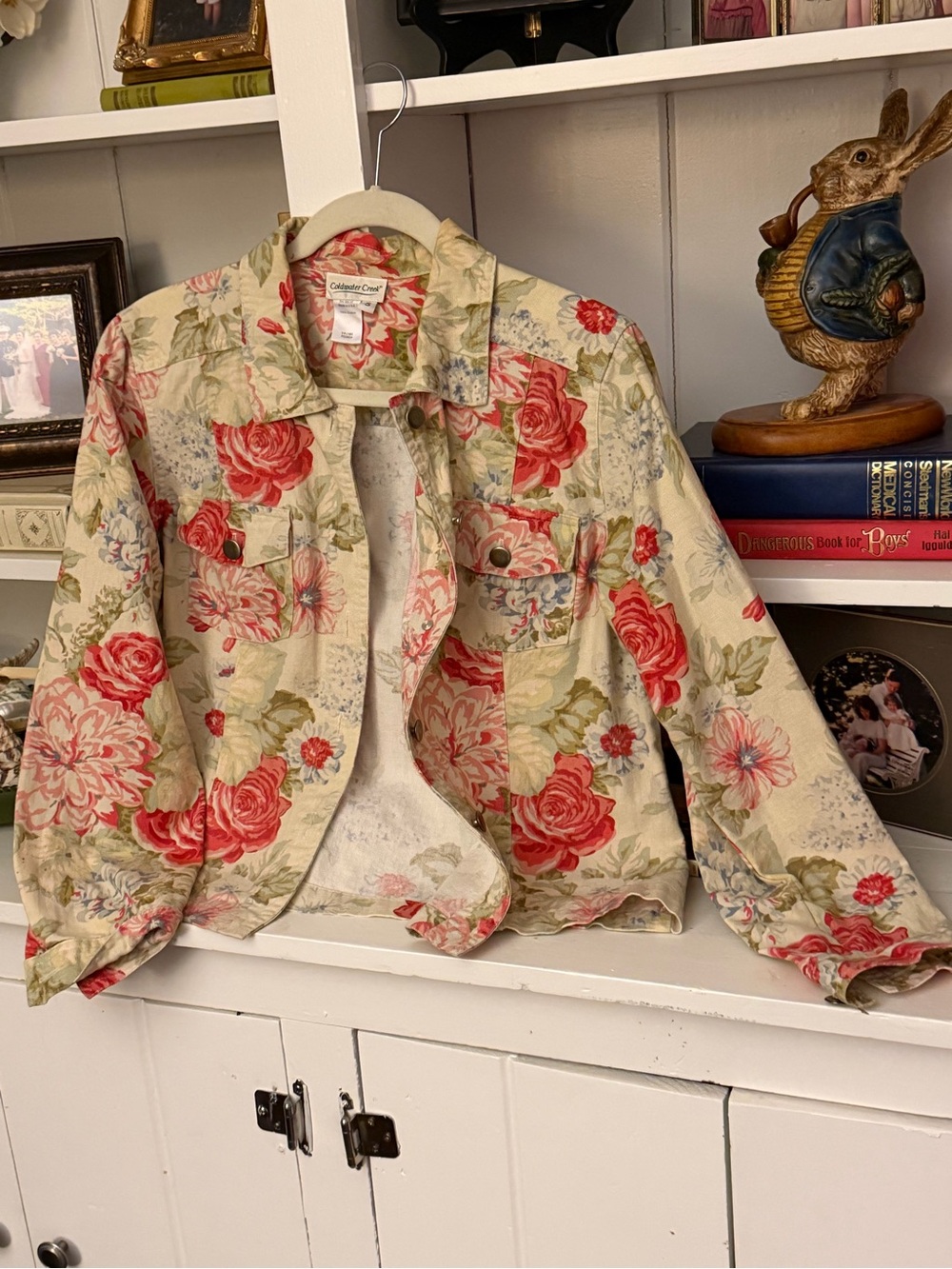 Coldwater Creek women’s  jacket with light fresh florals on cream background.